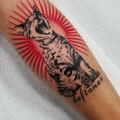 a tattoo with an image of a wolf on it