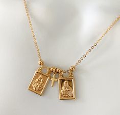 Gold filled scapular necklace If you're a catholic person, I'm sure you will like this dainty scapular with 18k gold filled chain. It's a necklace you can wear everyday. Simple, classic and elegant. MATERIAL AND SIZE 18k GoldFilled scapular Scapular size: 1.8cmx1.1cm 18k Gold filled chain Length: 16, 18 or 20 inches Our Lady of Mount Carmel and Sacred Heart If you have questions about the product, feel free to reach me out. Don't forget to check out my other items in the store: Https://www.etsy. Scapular Necklace, Our Lady Of Mount Carmel, Catholic Necklace, Mount Carmel, Catholic Rosary, Catholic Jewelry, Rosary Catholic, Religious Jewelry, Purse Jewelry