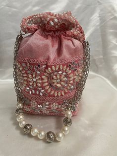 Style:potli bag  Utility: Potli, Pouch, Wedding Favor Bag Material: Silk Fabric, Mirror ,pearl,Thread Stones: off white  Base Color: Eng pink Traditional Pearl Embroidered Potli Bag For Formal Occasions, Pink Embroidered Potli Bag For Wedding, Traditional Pearl Embroidered Potli Pouch Bag, Pink Embroidered Potli Bag, Elegant Pink Embroidered Potli Bag, Potli Bags, Gold Plated Bangles, Step By Step Crochet, Creation Crafts