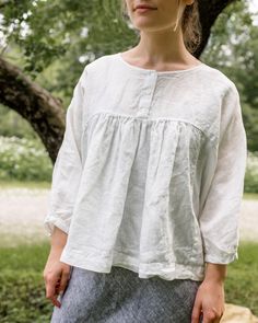 Loose fitting and relaxed, the Aria Top is as comfortable as it is cool- with three mother of pearl buttons at the front neckline that can be worn open or closed. 100% Linen. Made in the U.S.A. All of our pieces have been pre-washed and dried to minimize shrinkage. We recommend cold water wash and tumble dry low, or hang to dry. Linen Tops With Buttons For Daywear, Linen Button Tops For Daywear, Casual Blouse With Covered Buttons For Daywear, Casual Daywear Blouse With Covered Buttons, Linen Tops With Buttons For Casual Gatherings, Daywear Blouse With Buttons And Relaxed Fit, Relaxed Fit Daywear Blouse With Buttons, Summer Tops With Covered Buttons For Daywear, Spring Linen Tops With Covered Buttons