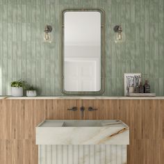 a bathroom with a marble sink and mirror