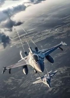 a fighter jet flying in the sky over land