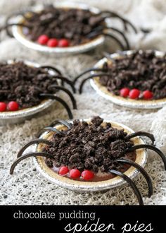 four desserts with chocolate and candy on them are arranged in the shape of spider's legs