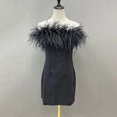 Beautiful raw edge black denim mini dress with ostrich feather trim. Make a statement with this fun feather trimmed dress! * Sizing - All items are made according to measurement ranges, they are NOT typical letter or numeric sizing. It is imperative to compare your exact measurements with the size chart provided either in the listing photos or item descriptions and to also add your measurements under Personalization. If you have any questions on sizing, please feel free to message me. Do not order your normal size without taking and comparing measurements. * EXCHANGES ONLY. Returns will not be accepted. I have explained the importance of adding your exact measurements under Personalization and/or sending them to me so that I can help with the proper sizing. I cannot be responsible if you d Ostrich Feather Trim, Fur Dress, Crystal Dress, Feather Tops, Womens Denim Dress, Sequin Blazer, Sequin Jumpsuit, Feather Trim, Ostrich Feather