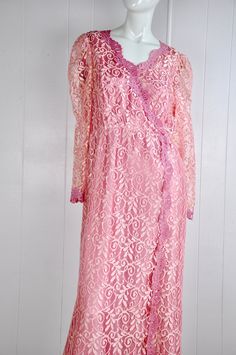 "A darling pink lace dress by JC Penney circa the 60s / 70s. It has little snaps at the sleeves, nape, and bust. There's a back zipper closure with a natural opening in the lace fabric to allow for the zipper to move. Made in the USA. Would suit a small or petite medium, but please see measurements below for accurate fit. CONDITION: Great gently worn condition. No flaws to note. MEASUREMENTS Bust: 38\" Waist: 30\" Length: 51\" Have a question? Please ask me anything." Pink Feminine Lace Dress For Wedding, Pink Scalloped Lace Dress For Bridesmaids, Pink Long Sleeve Lace Dress For Wedding, Pink Scalloped Lace Bridesmaid Dress, Pink Bridesmaid Lace Dress With Scalloped Lace, Pink Long Sleeve Lace Wedding Dress, Pink Lace Dress With Lace Sleeves For Wedding, Pink Evening Lace Dress With Lace Trim, Pink Lace Sleeve Wedding Dress