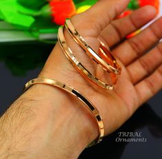 This is fabulous Solid kada bangle made by pure 92.5 sterling silver and finished by Rose gold polish over silver bangle, worn by Mostly punjabi Sikkha and and all over India. Metal-925 sterling silver. Item type-Punjabi kada bangle. Weight-18 grams to 29.120 grams(weight will be vary as per size) Size- 2-2 to 3 (select your size from option) Size and weight:(diameter) 2 or 2 inches-20.120 grams. 2-2 or 2.125 inches--22.330 grams. 2-4 or 2.25 inches-23.600 grams. 2-6 or 2.375 inches-24.00 grams. 2-8 or 2.5 inches-25.00  grams. 2-10 or 2.62 inches-26.6 grams. 2-12 or 2.75 inches-27.300 grams. 2-14 or 2.87 inches-32.800 grams. 3 or 3 inches-33 grams. Width-6 mm. Stamped-925 Finish-Rose Gold polished over pure silver bangle. Makes excellent gifting for all festival season or wedding anniversa Rose Gold Bangle With Polished Finish For Wedding, Rose Gold Polished Bangle For Wedding, Punjabi Kada, Traditional Rose Gold Bangle As Gift, Traditional Rose Gold Bangle Bracelets, Traditional Rose Gold Bangle Bracelet, Rose Gold Bangle For Anniversary With Polished Finish, Anniversary Rose Gold Bangle With Polished Finish, Hand Chain Jewelry