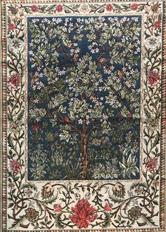 an intricately designed rug with trees and flowers