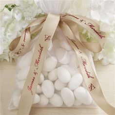 a bag filled with white candies on top of a table