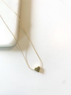 Wear this and remember you are so loved. Product Details: 18"Gold Filled Necklace with Gold Slide Bead Heart. Product Care: We recommend removing before showering, swimming and exercise. Avoid exposing your necklace to perfume and hard chemicals; it may cause a reaction to the metal. Clasp Closure Handmade Hypoallergenic Heart Necklace For Valentine's Day, Minimalist Hypoallergenic Heart Necklace For Valentine's Day, Minimalist Hypoallergenic Heart Necklace, Bead Heart, Gold Slides, Gold Filled Necklace, I Love Heart, Be Still, Heart Necklace