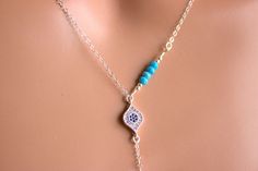 "This is a 925 sterling silver, multi strand Evil Eye Lariat Y style necklace! Genuine turquoise gemstones 3-4mm make this double strand necklace stunning! Necklace has a shorter choker length chain and a longer Y style chain with an evil eye center pendant with small pave blue crystals. A 1\" sterling silver bar pendant with a turquoise gemstone hangs from drop. Drop measures 3\" with bar pendant.ds This is stunning statement piece, makes a great gift for that unique lady! Comes nicely boxed, f Blue Sterling Silver Lariat Necklace Gift, Blue Sterling Silver Lariat Jewelry, Blue Sterling Silver Lariat Necklace, Blue Lariat Necklace As A Gift, Elegant Blue Sterling Silver Lariat Necklace, Bohemian Blue Jewelry With Delicate Chain, 14kt Gold Jewelry, Lariat Necklaces, Necklaces Blue