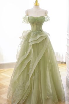 Discover the epitome of sophistication with "Nellie," an elegant green tulle lace long prom dress that exudes grace. This enchanting A-line silhouette boasts an alluring off-the-shoulder neckline, sleek sleeveless design, and a lace-up back for a flawless fit. Adorned with a unique horsehair skirt and exquisitely appliqued illusion corset, this dress is perfect for any formal event or enchanting evening. Details: Silhouette: A-Line Style Fabric: Lace Fabric Color: Green, Black, Pink & White Colo Sage Green Prom Dress, Green Formal Dresses, Dress With Corset, Green Tulle, Floor Length Prom Dresses, فستان سهرة, Formal Party Dress, A Line Prom Dresses, Green Prom Dress