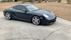 a black sports car parked on the street