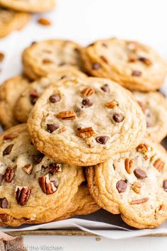 chocolate chip pecan cookies stacked on top of each other