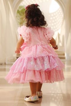 Pink tiered sequined frock with frilled sleeves and a big bow in the center. - Aza Fashions Pink Ruffle Dress For Dress-up, Pink Ruffle Dress For Dress-up Occasions, Princess Style Party Frock With Ruffles, Princess Style Frock With Ruffles For Parties, Pink Tiered Ruffle Dress For Party, Pink Princess Style Ruffle Dress For Party, Pink Princess Ruffle Dress For Parties, Tiered Ruffle Dress For Dress-up, Pink Princess Style Party Ruffle Dress