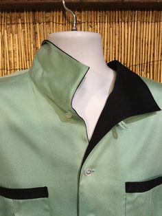 "1950s vintage reproduction Hollywood Rogue two tone aqua shirt This garment has a loop collar, two pleated front pockets and a five button down front. The shirt is a aqua blue with constrasting black collar and across top of pockets. This shirt as with all clothing made by \"Hollywood Rogue\" was made in very limited numbers. The label reads \"Hollywood Rogue\" and the shirt is in unworn condition with the tags still attached. Made in the U.S.A. PLEASE NOTE: These garments run large. See measur Retro Green Top With Pockets, Fall 24, Rockabilly Fashion, 50s Fashion, 1950s Fashion, Clothing Styles, 1950s Vintage, Mens Clothing, Shirt Collar