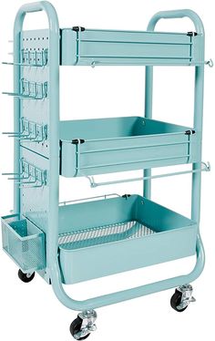 a light blue cart with three trays on the front and two baskets on the back