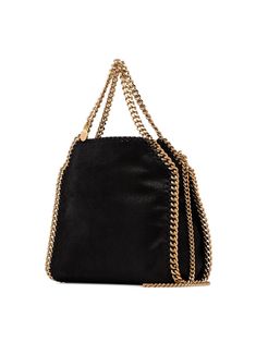 Didn't you know that a lady's outfit is never complete without a trusty bag by your side? Don't leave your house without this glamorous black faux leather black mini Falabella tote from Stella McCartney that has elegant a gold-tone chain trim adorning the front. The perfect companion to carry you throughout the day. Featuring top handles, an optional chain strap, an engraved logo charm, and a snap fastening. POSITIVELY CONSCIOUS: We’ve joined forces with ethical agency Good On You to give you th Evening Tote Shoulder Bag With Chain Strap, Top Handle Bag With Chain Strap For Night Out, Party Shoulder Bag With Double Handle And Dust Bag, Double Handle Shoulder Bag With Dust Bag For Party, Black Shoulder Bag With Double Handle For Evening, Evening Bag With Chain Strap And Double Handle, Evening Bags With Chain Strap And Double Handle, Black Double Handle Shoulder Bag For Evening, Chic Black Shoulder Bag With Dust Bag