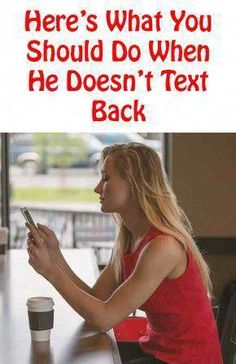 a woman sitting at a table looking at her cell phone with the caption here's what you should do when he doesn't text back