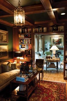 a living room filled with furniture and bookshelves