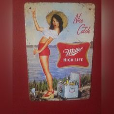 an old metal sign advertising miller's high life with a woman in red shorts and straw hat