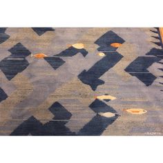 an area rug with various shapes and colors