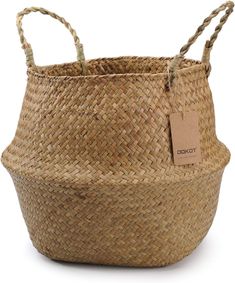 a woven basket with a tag hanging from it's handle and two handles on the bottom