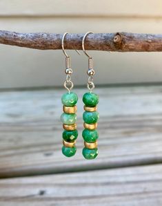 Handmade earrings  Silver earrings  Green and gold beads Dangle earrings  Unique/one of a kind earrings  Nickel free Green Dangle Beaded Earrings With Gold Beads, Green Drop Earrings With Gold Beads, Green Gold Beaded Drop Earrings, Festive Green Beaded Earrings, Green Beaded Dangle Earrings For Festive Occasions, Bohemian Green Earrings With Gold Beads, Elegant Green Beaded Earrings With Gold Beads, Green Dangle Earrings For Festive Occasions, Silver Earrings With Gold Beads As Gift