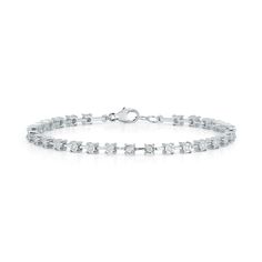 Meet the diamond station bracelet your jewelry box will almost never see because you'll hardly ever be without it. Just under a half-carat of white round diamonds sparkle in 14k gold intervals. This unique diamond bracelet is a fresh take on the classic diamond tennis bracelet that will take you from every outfit and occasion to the next seamlessly. Each diamond station features a ring of faceted 14k gold to enhance the shape of the diamond and add extra sparkle.Dana's tip: I love this classic t Formal Gold Baguette Cut Tennis Bracelet, Minimalist Diamond-cut Tennis Bracelet For Weddings, Cubic Zirconia Tennis Bracelet With Diamond Accents, Baguette Cut, Elegant Gold-plated Tennis Bracelet With Diamond Accents, Adjustable 14k Gold Tennis Bracelet, Fine Jewelry, Dana Rebecca Designs, Station Bracelet, Bracelet Diamond, Diamond Tennis Bracelet