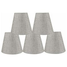 four grey lampshades on a white background