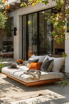 a couch sitting on top of a wooden patio