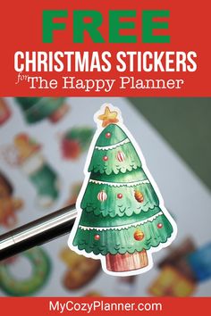 a christmas tree sticker with the text free christmas stickers for the happy planner