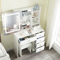 a white desk with drawers and a mirror