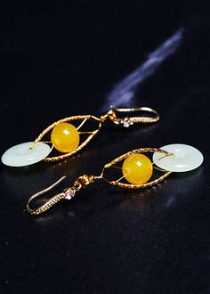 Fine White Jade Handmade Concatenation Beeswax Drop Earrings925 Silver.Made of fine Jade Beeswax.Measurement: 5.7cm/2.223" * 2cm/0.78". Matches easily with daily hairstyle, dresses & Shirts Elegant Yellow Earrings With Natural Stones, Yellow Jade Round Jewelry, Yellow Round Jade Jewelry, Round Yellow Jade Jewelry, Unique Gold Jade Earrings, Round Jade Earrings For Wedding, Jade Round Earrings For Wedding, Elegant Round Jade Earrings For Weddings, May Designs