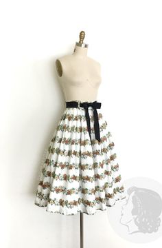 vintage skirt  Era: 1950's Label: none Material: cotton Closure: side metal zipper, button waist Colour: white, browns, green, tan  Details: small floral print that forms a striped pattern and a classic pleated full skirt silhouette. Medium size waist band and a full pleated skirt Fits like: small Waist: 26" Hips: free Length: 29.5" Condition: Excellent other than a small grey spot in the middle which, looks like a print irregularity. The waist ribbon is not original. Priced accordingly.  Washed Ruby Mae, 1950s Skirt, 1950’s Fashion, Small Floral Print, Rose Vintage, Skirt Fits, Floral Stripe, 1950s Vintage, Full Skirt