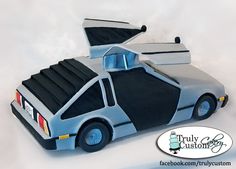 a cake shaped like a car with its hood open