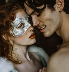 a man and woman are wearing masquerades with their faces close to each other