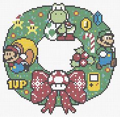 a cross stitch christmas ornament with the letter c in it's center