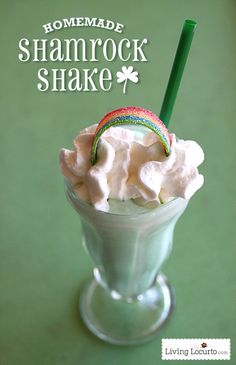 a drink with whipped cream and a green straw