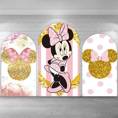 three mickey and minnie mouse wall hangings in a room with white brick walls, pink polka