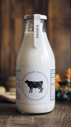 a bottle of milk sitting on top of a wooden table