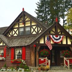 a red, white and blue house with an american flag on it