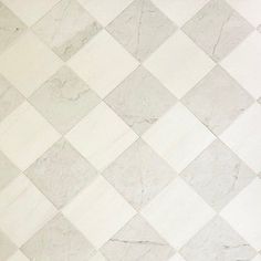 a white and grey checkered tile floor