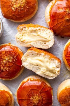 baked goods displayed on white paper with oranges in the background