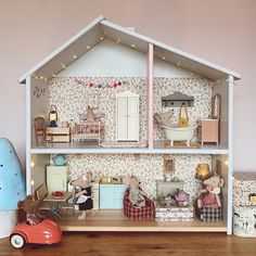 a doll house with furniture and accessories in it