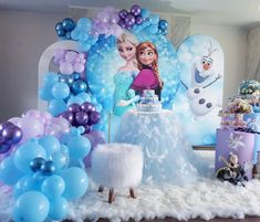 a frozen princess birthday party with balloons and decorations