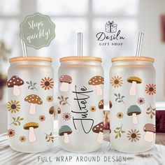 three white mason jars with mushrooms and flowers on them, one is full wrap around design