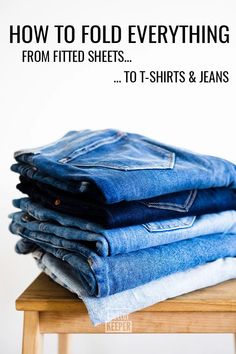 several folded jeans stacked on top of each other with the words how to fold everything from fitted sheets to t - shirts & jeans