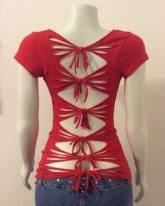 a mannequin wearing a red top with cutouts on it's back