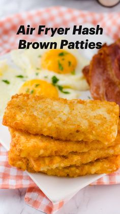 air fryer hash browns on a plate with bacon and eggs