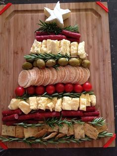 a christmas tree made out of food on top of a cutting board